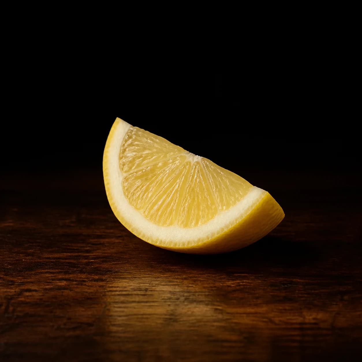 Fresh triangular lemon wedge