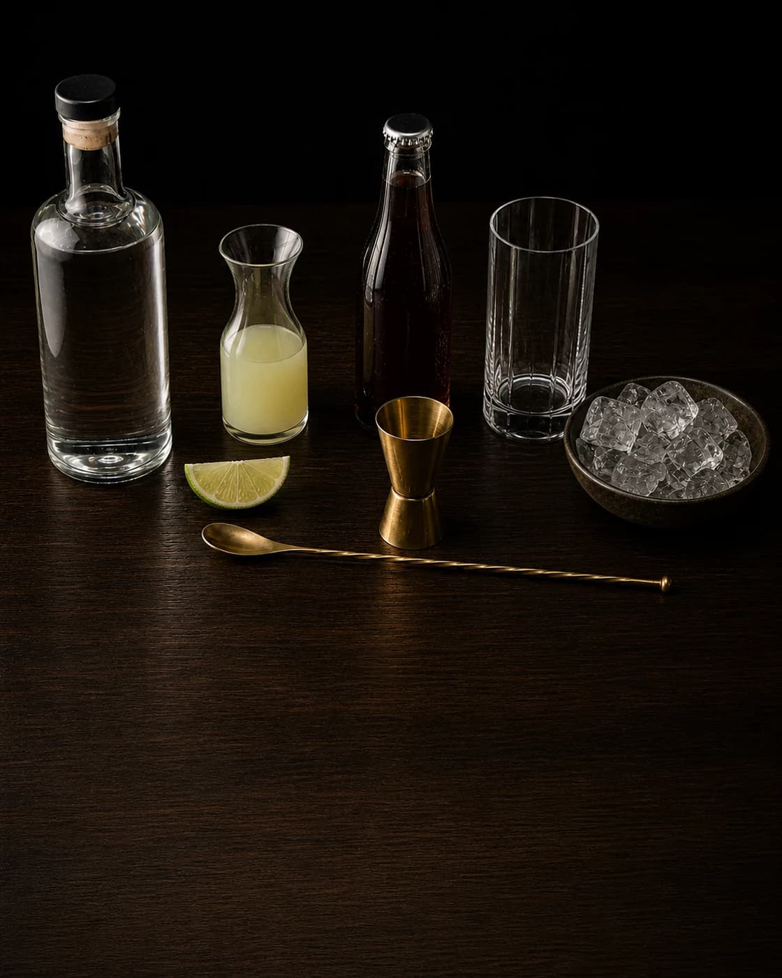 Overhead Cuba Libre station arranged on a dark walnut bar