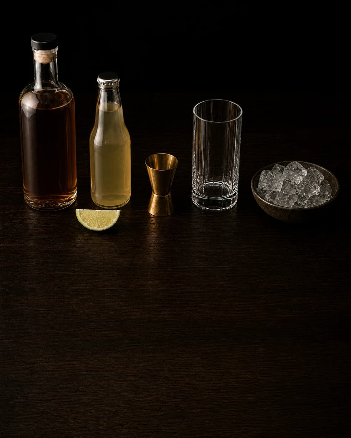 Overhead Dark ’N’ Stormy station arranged on a dark walnut bar