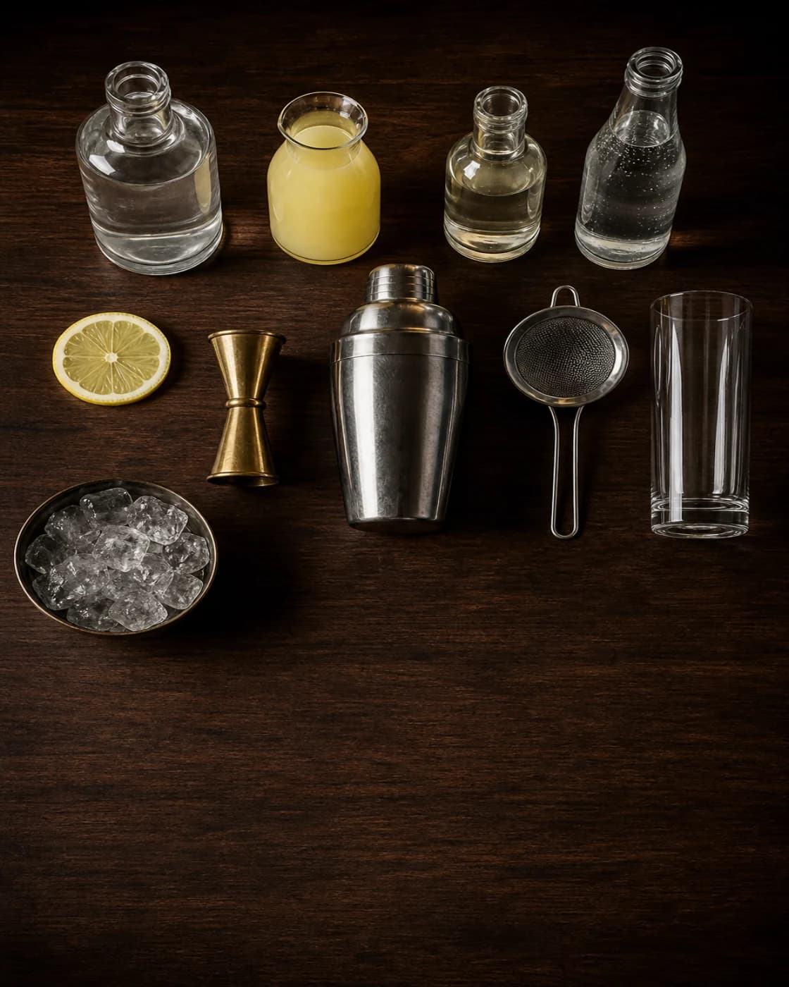Overhead Gin Fizz station arranged on a dark walnut bar