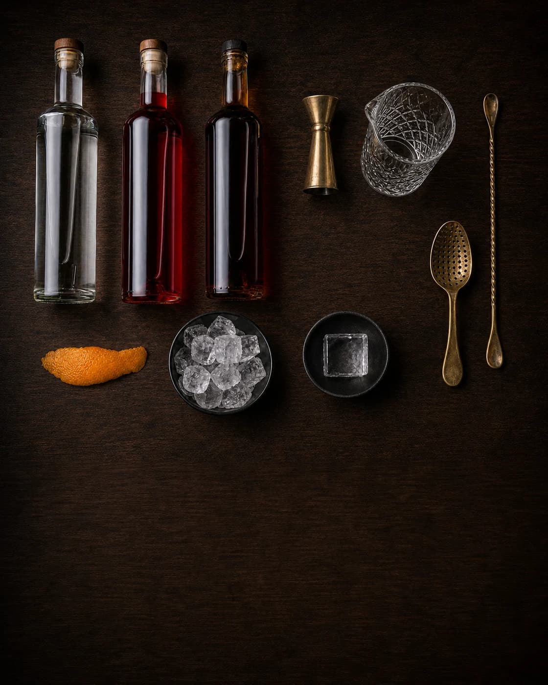 Overhead Negroni station arranged on a dark walnut bar