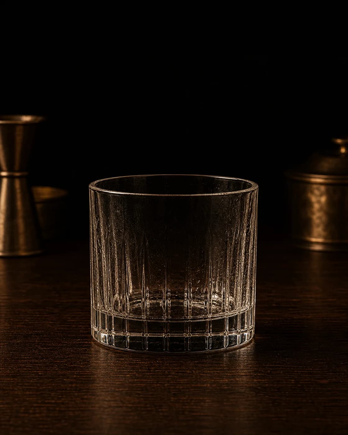 Season the glass stage with aged brass cocktail jigger