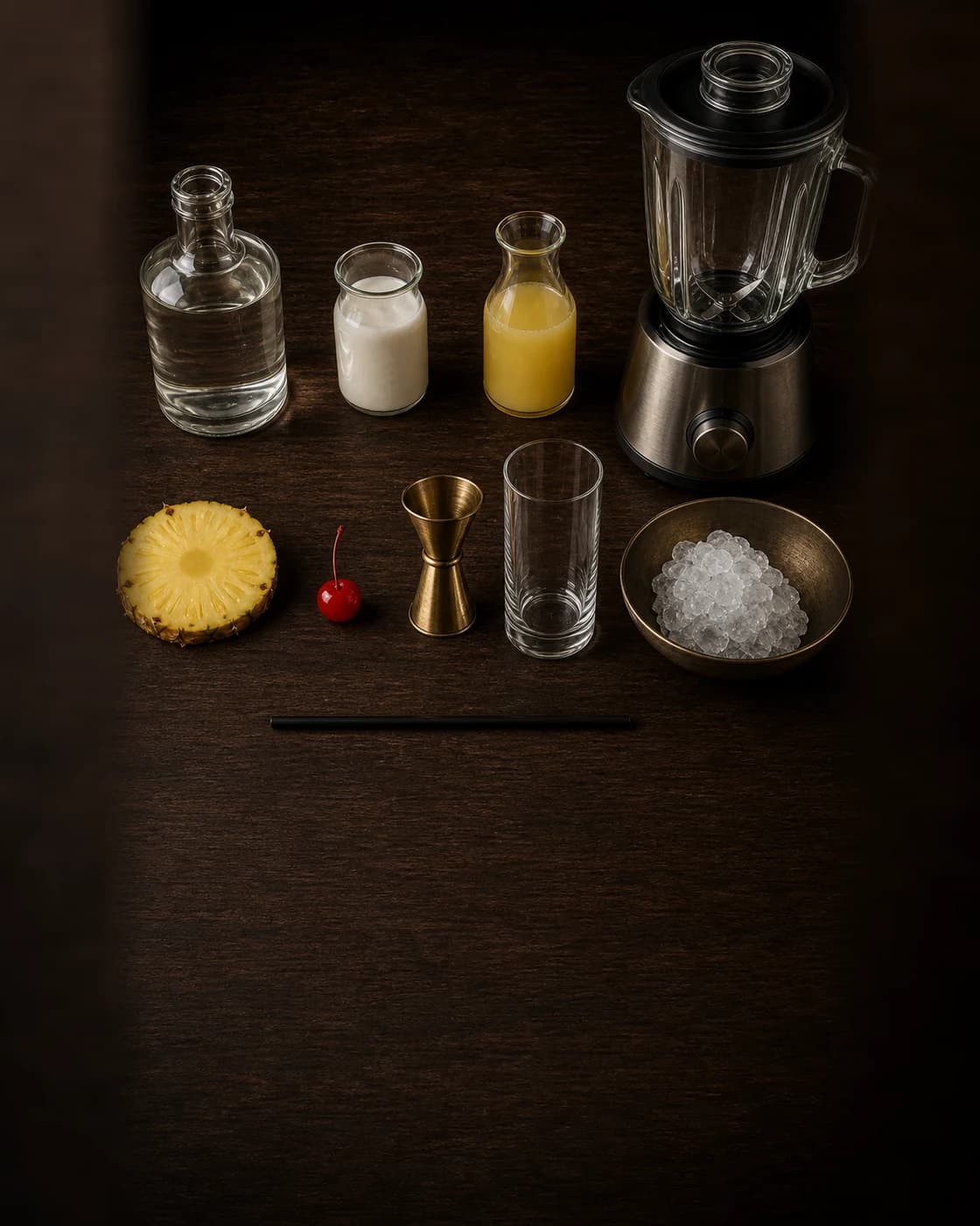 Overhead Piña Colada station arranged on a dark walnut bar
