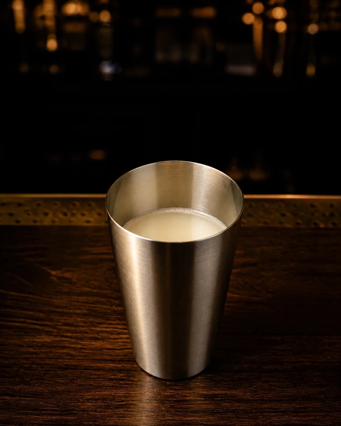 Fill the shaker with ice stage with metal scoop filled with ice cubes