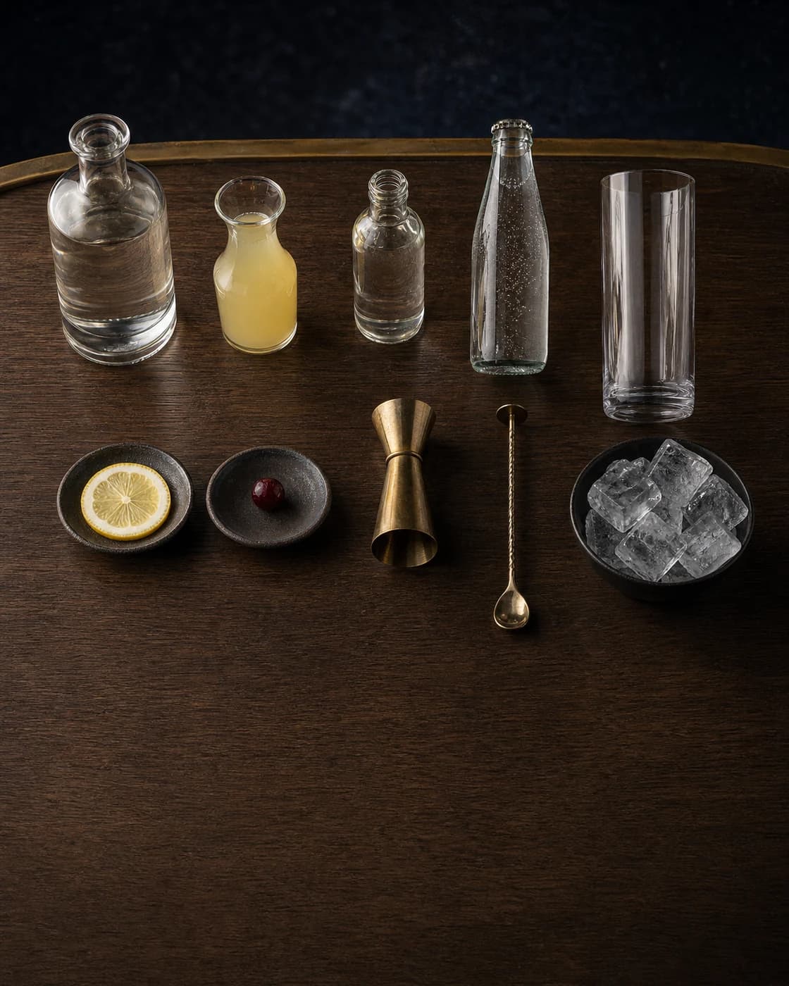 Overhead Tom Collins station arranged on a dark walnut bar