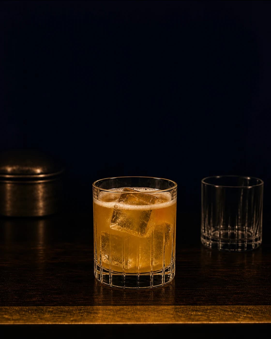 Add the cherry stage with dark red cocktail cherry on a brass cocktail pick